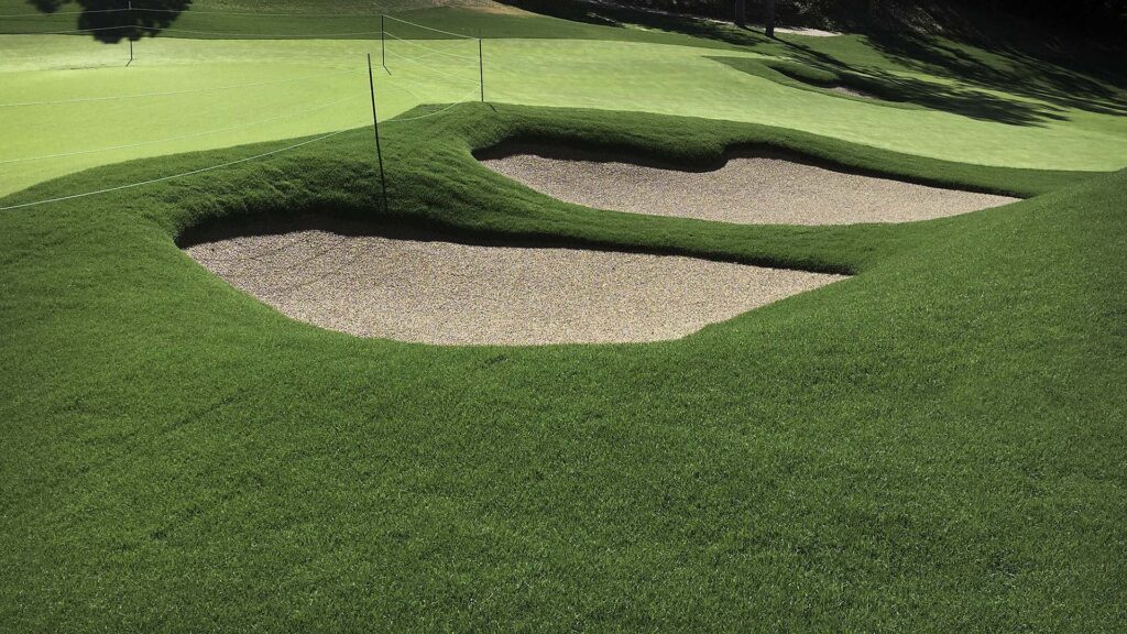 We like to use big roll sod on bunkers. This allows us to install larger, heavier pieces of sod that are less prone to sliding when installed. When necessary, sod is pinned down using biodegradable wood dowels.